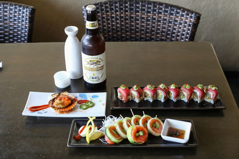 Clockwise from top left: sake, Kirin Ichiban beer, Maui roll, rice-free cucumber wrap, pink scallop