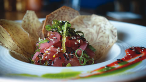 Pickled onions top the poke appetizer at Tabu Grill.